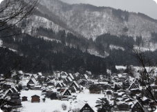 dark distant view of the village covered in snow